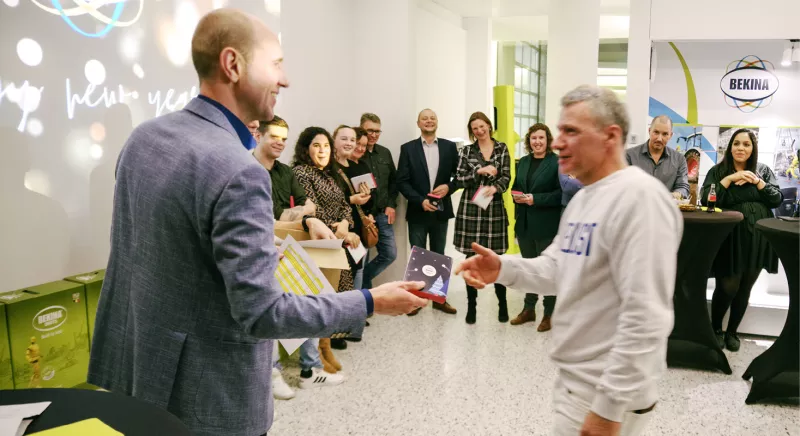 Thomas Vanderbeking giving a present to a employee