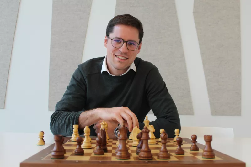 Colleague David Roos playing chess